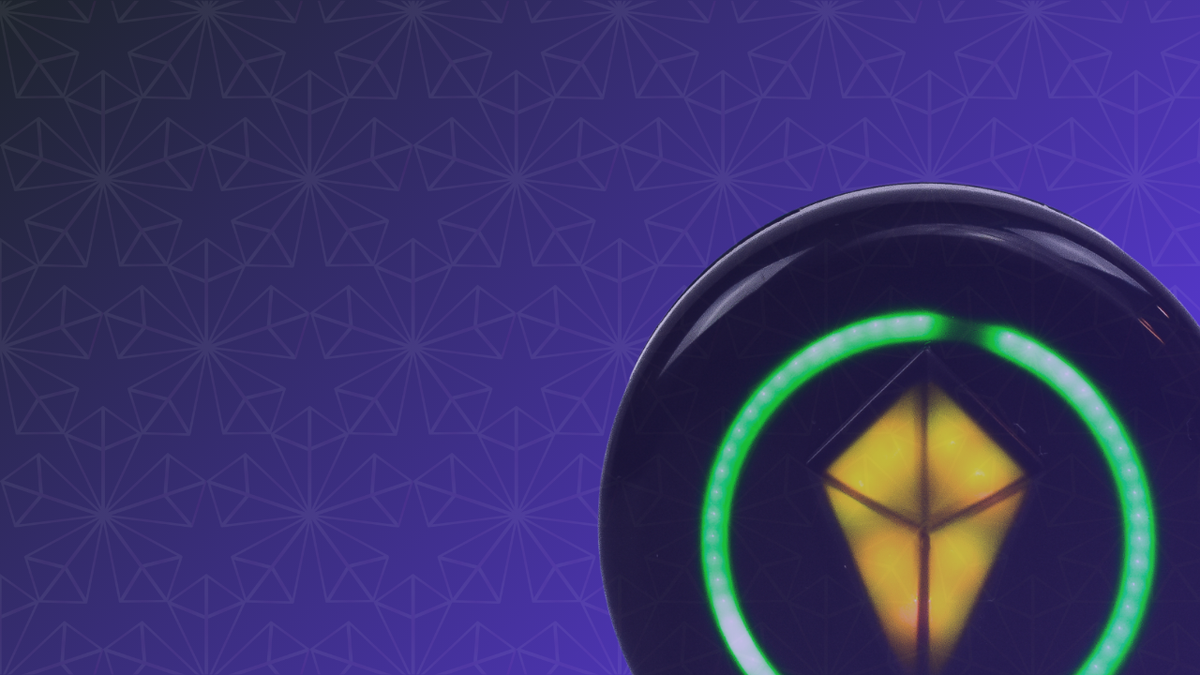 Close-up of a Totem Compass with a yellow Touch Crystal inside a full green ring, on a purple patterned background