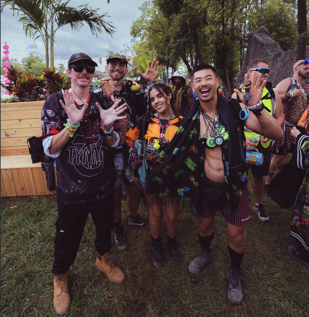A festival crew showing off their Totem Compasses