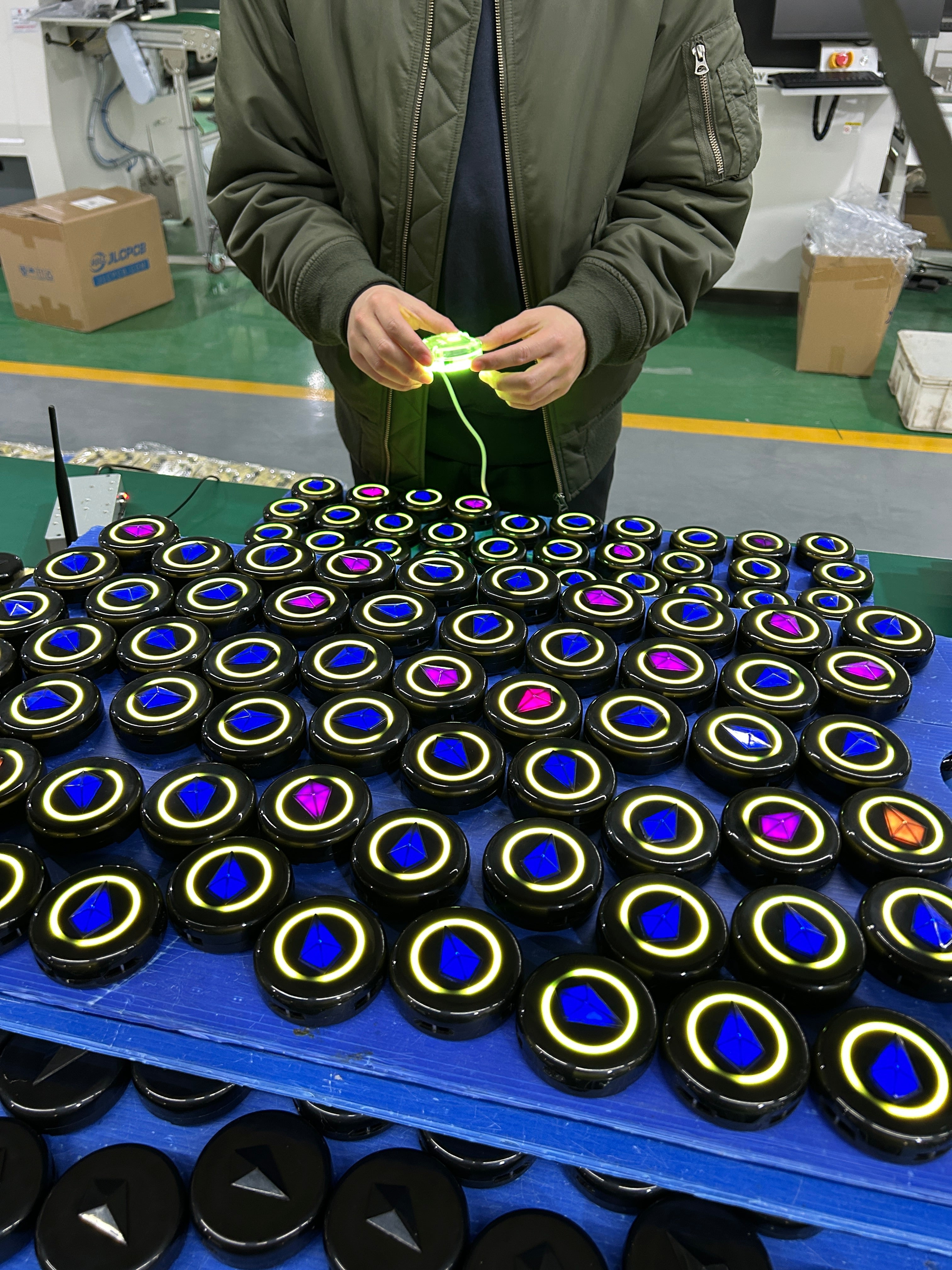 loading software onto new Totem festival compasses at the factory